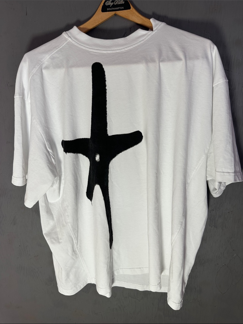 White Short-Sleeve Tee with Bold Black Cross Graphic